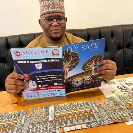 An Azman Air representative reading Fly Safe Magazine