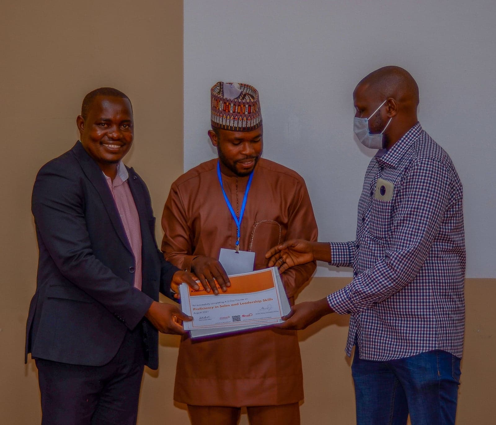 A training certificate being presented during a Shafa Energy programme in Kano.